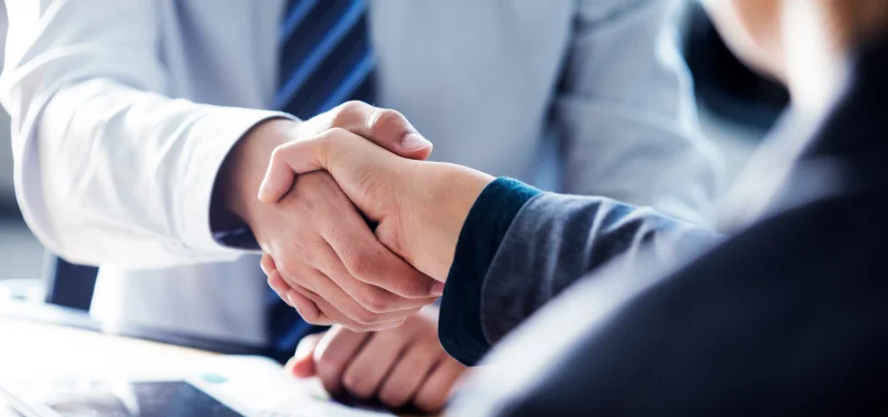 People shaking hands in a business meeting